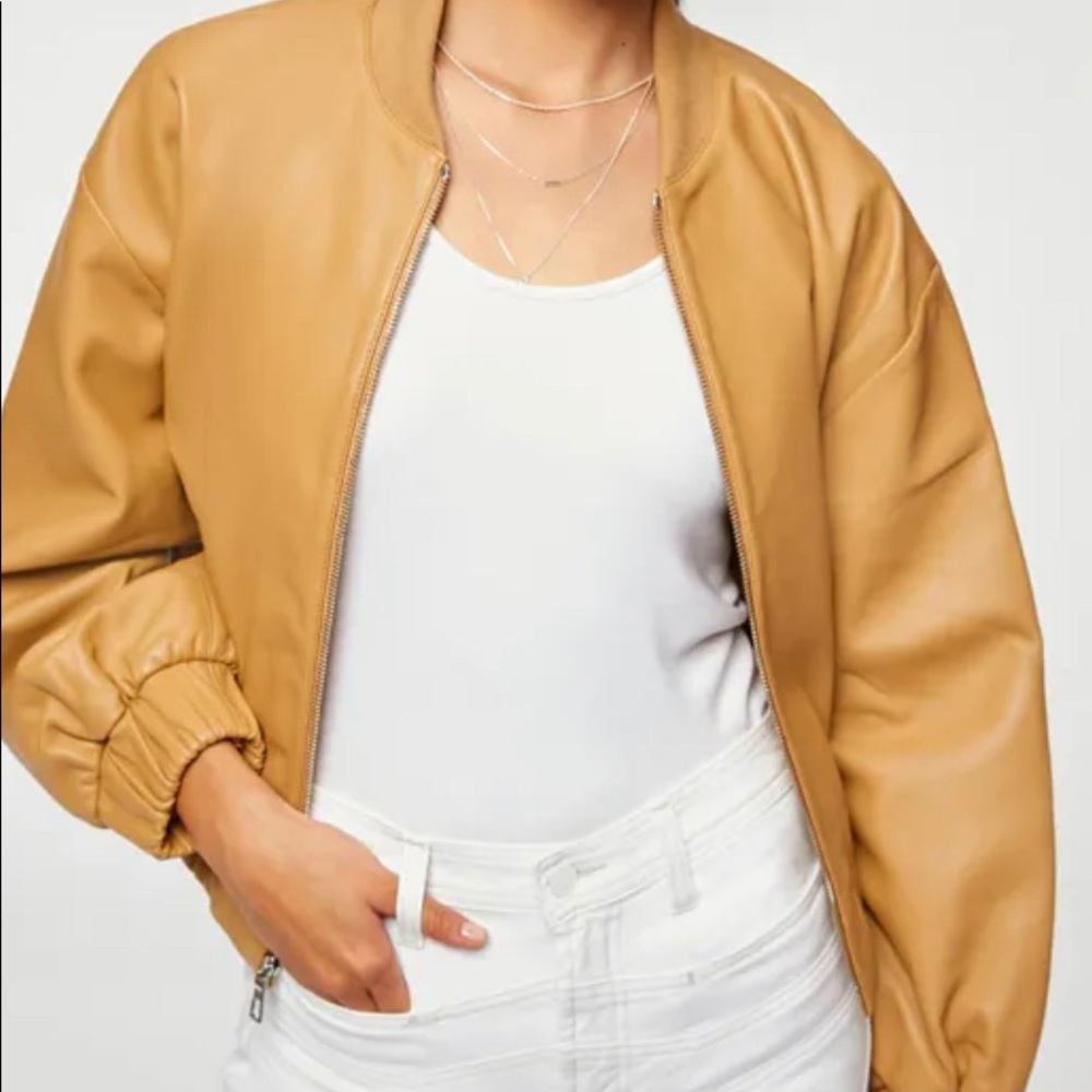 New Leather bomber Jacket. It looks fabulous on. It is of Import 100% Leather.